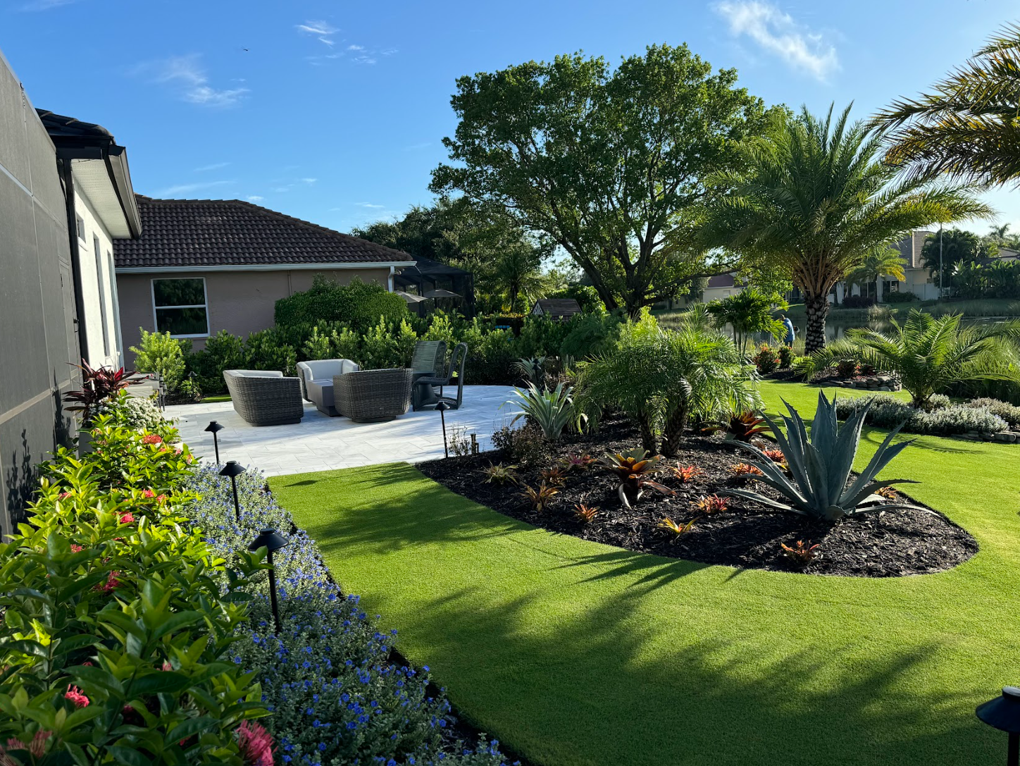 Stadium Zoysia lawn beside a landscaped home
